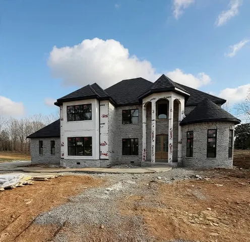 a front view of a house with a yard