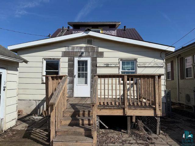 526 South 12th Street Virginia, MN 55792 - Photo 16 of 17 Rear view of property with a deck and a metal roof