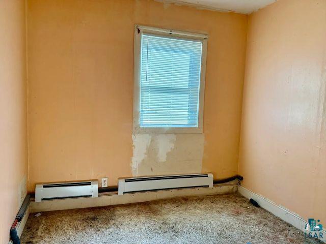 526 South 12th Street Virginia, MN 55792 - Photo 10 of 17 Carpeted empty room with baseboard heating