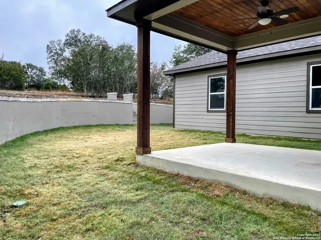a view of a backyard of the house