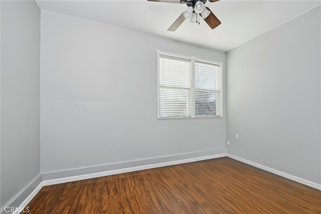 18216 Hidden Valley Road Hidden Valley Lake, CA 95467 - Photo 18 of 26 wooden floor in an empty room with a window