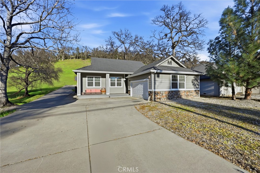 18216 Hidden Valley Road Hidden Valley Lake, CA 95467 - Photo 2 of 26 a front view of a house with a garden