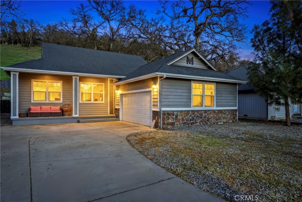 18216 Hidden Valley Road Hidden Valley Lake, CA 95467 - Photo 26 of 26 a front view of a house with a yard and garage