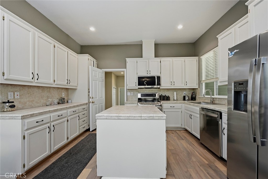 18216 Hidden Valley Road Hidden Valley Lake, CA 95467 - Photo 7 of 26 a kitchen with cabinets stainless steel appliances and sink