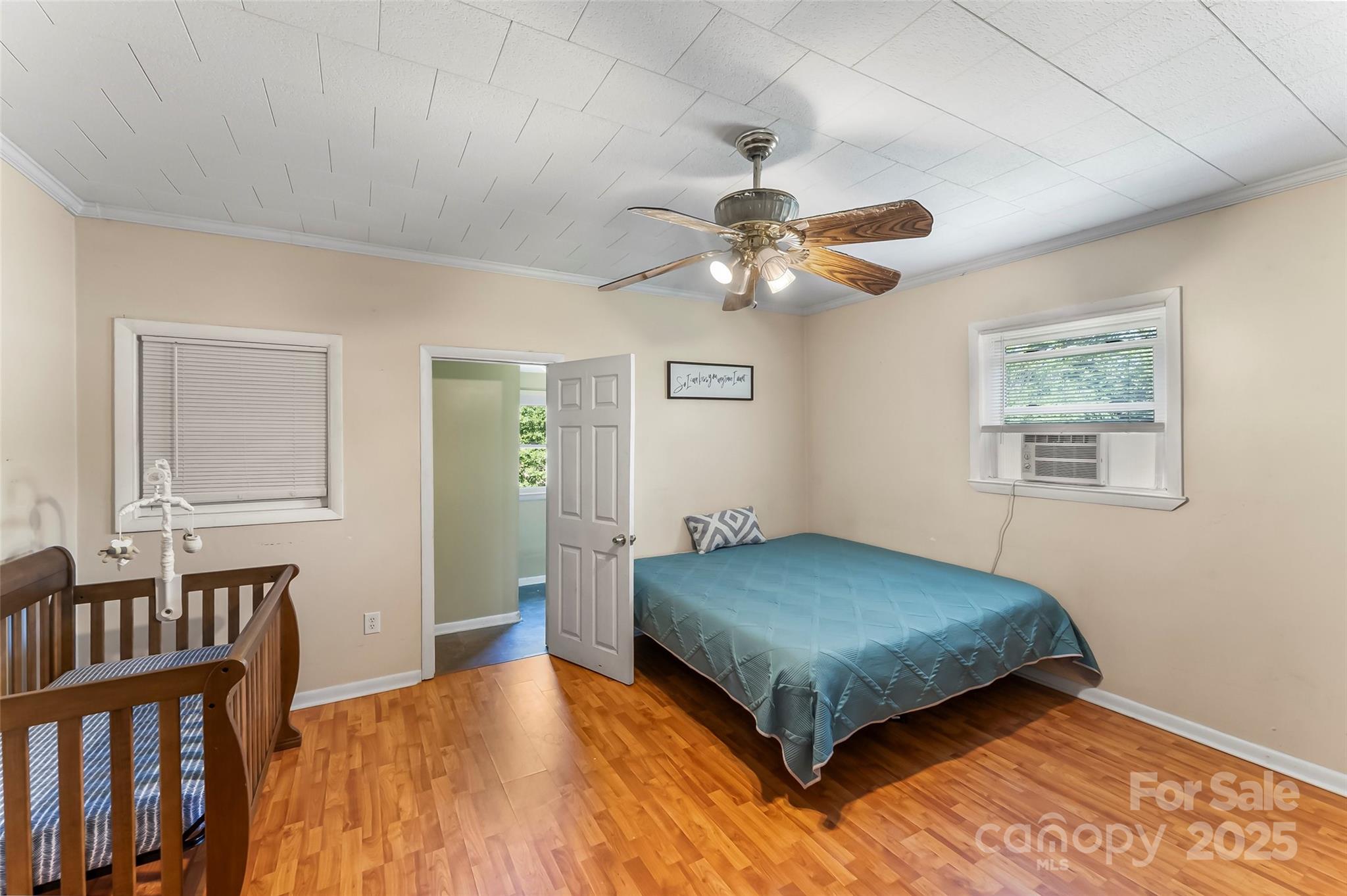 205 Abington Road Northwest Lenoir, NC 28645 - Photo 11 of 19 a bedroom with a bed and a chandelier