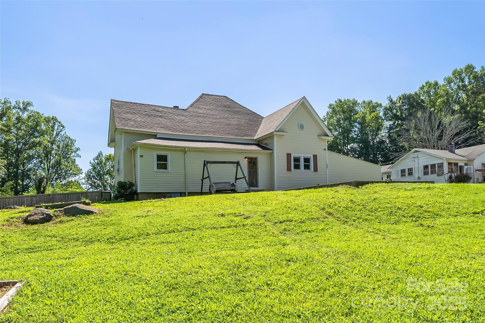 205 Abington Road Northwest Lenoir, NC 28645 - Photo 19 of 19 a front view of house with yard and trees in the background