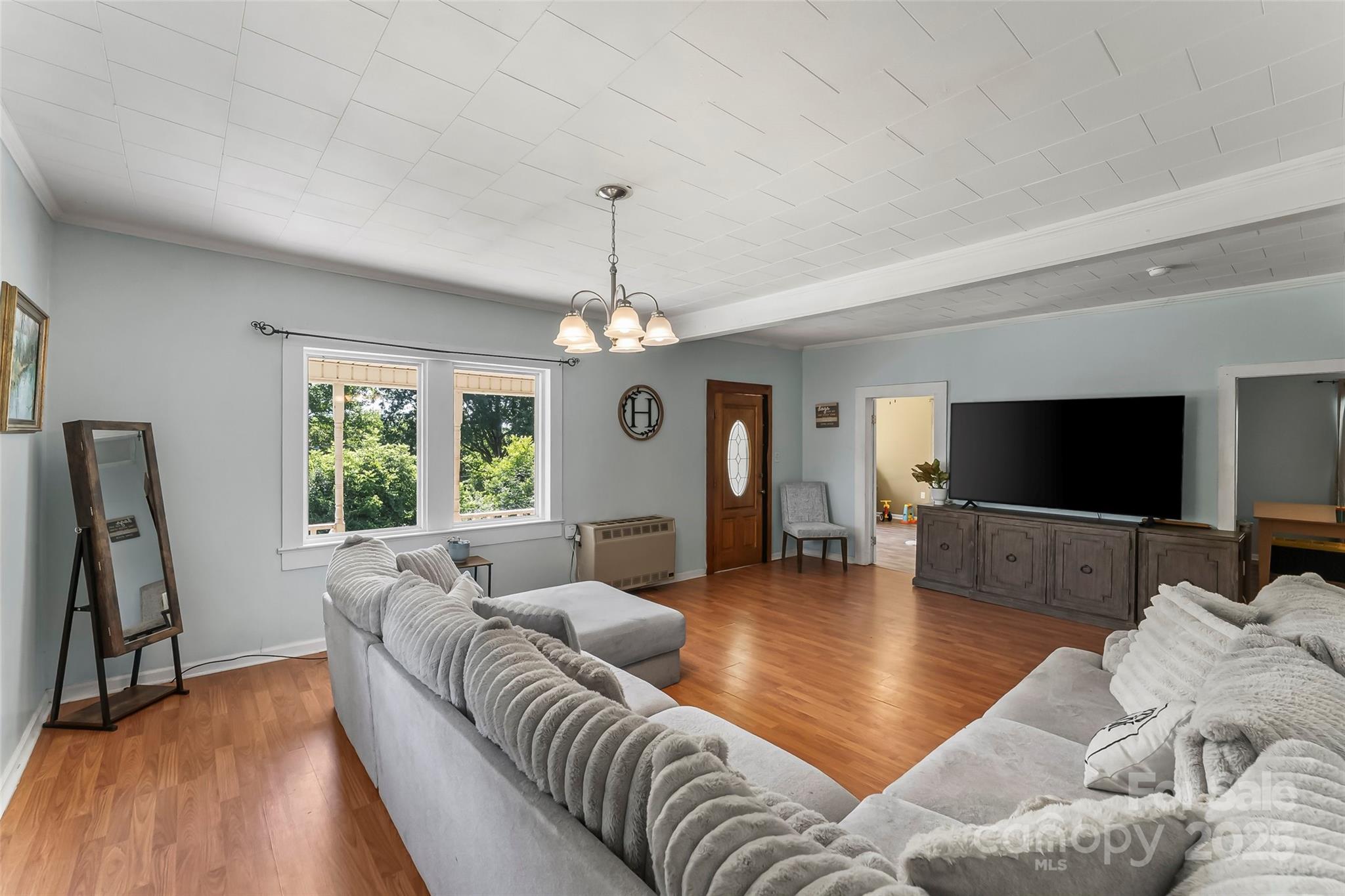 205 Abington Road Northwest Lenoir, NC 28645 - Photo 5 of 19 a living room with furniture a flat screen tv and a large window