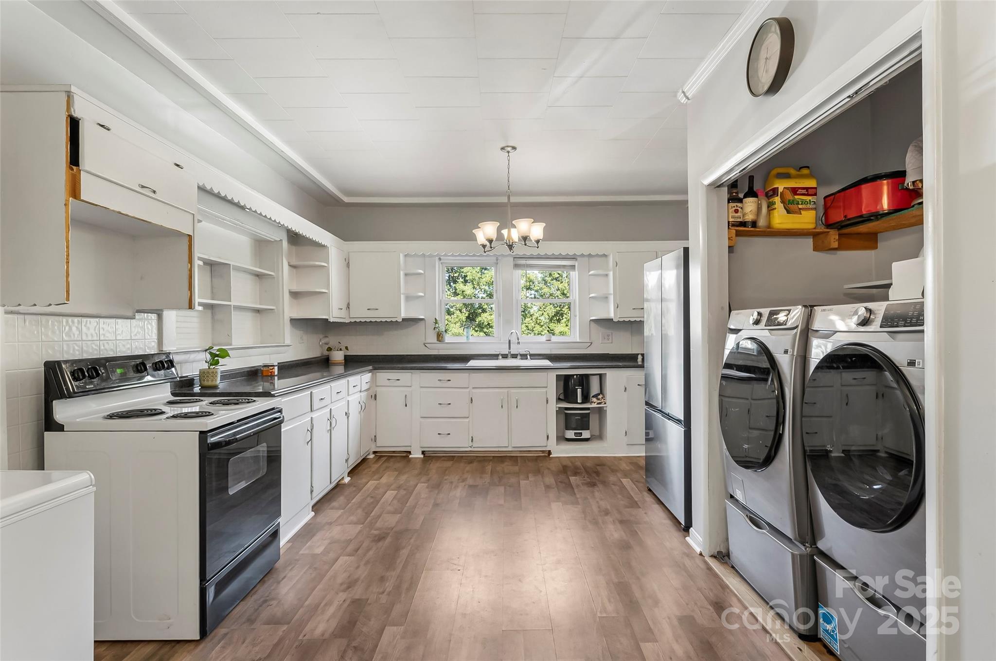 205 Abington Road Northwest Lenoir, NC 28645 - Photo 6 of 19 a kitchen with stainless steel appliances granite countertop a stove and a refrigerator