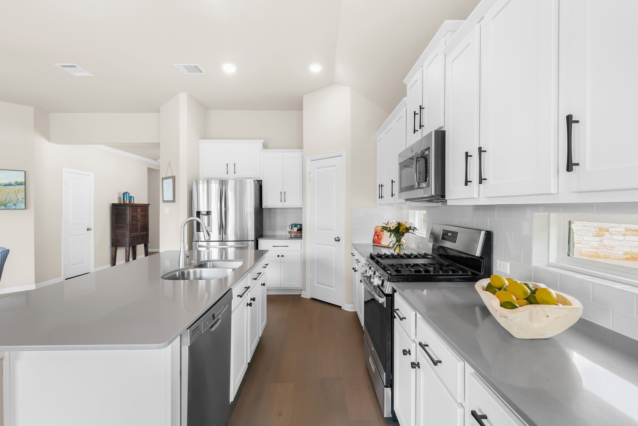 300 Prato Place Georgetown, TX 78628 - Photo 12 of 40 A well-appointed kitchen features stainless steel appliances, abundant cabinetry, and an inviting island.