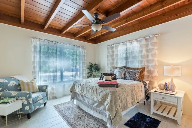 a bedroom with a bed and a couch