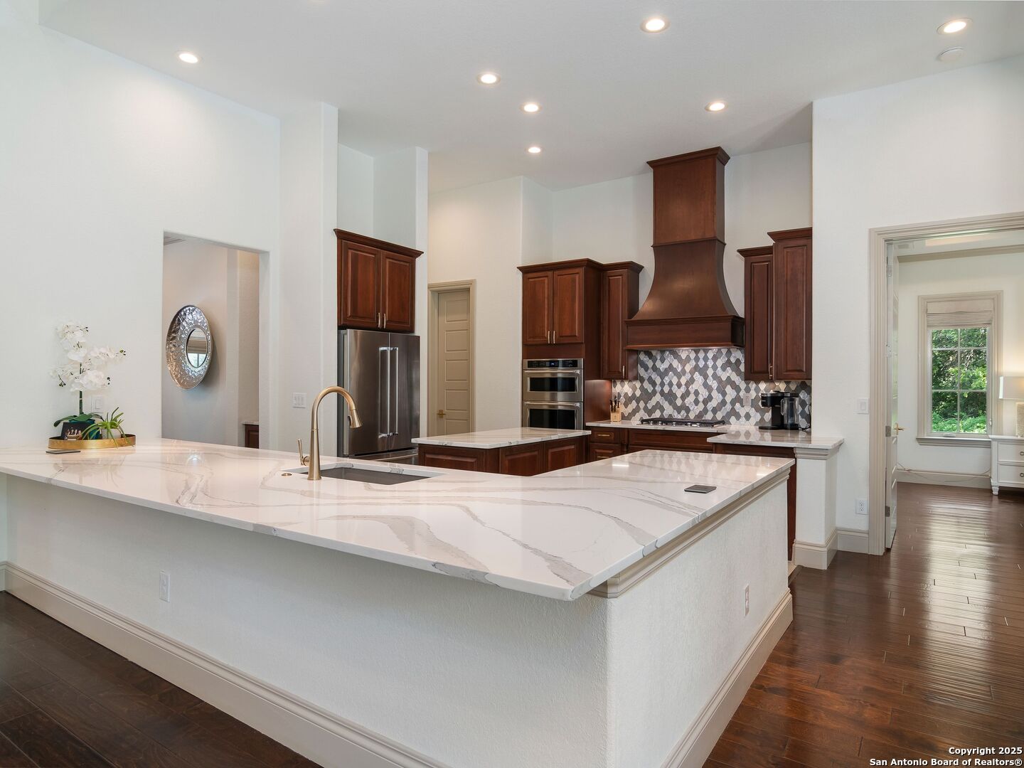 110 Manorbrook San Antonio, TX 78230 - Photo 13 of 40 a kitchen with stainless steel appliances kitchen island granite countertop a refrigerator and a sink