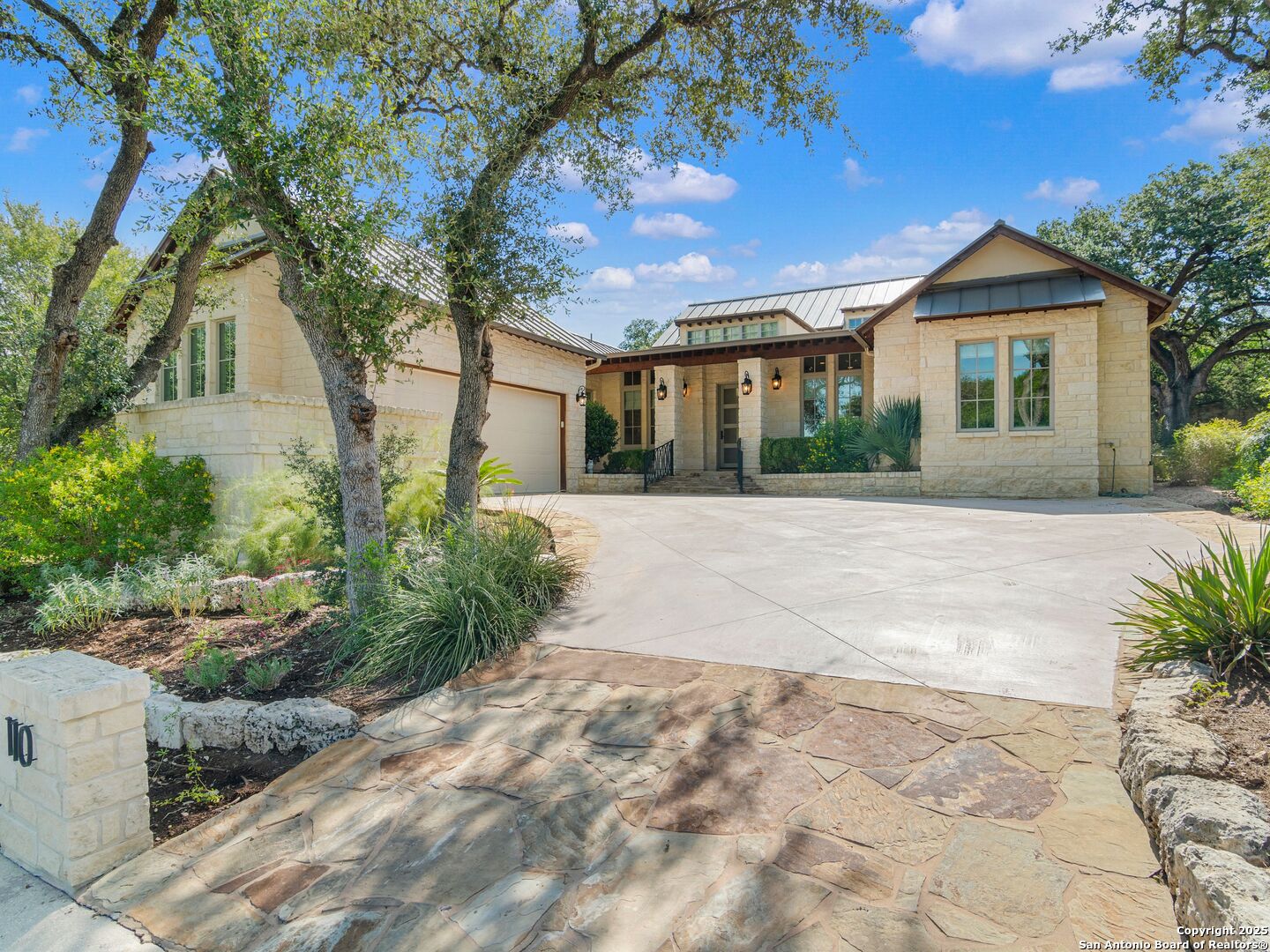 110 Manorbrook San Antonio, TX 78230 - Photo 2 of 40 a front view of a house with a yard and potted plants