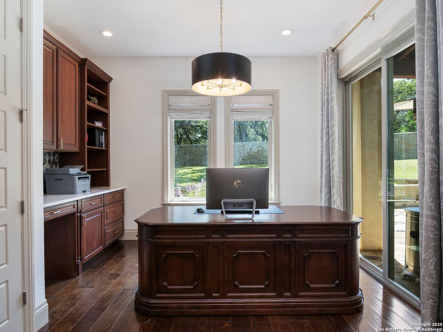 110 Manorbrook San Antonio, TX 78230 - Photo 22 of 40 a kitchen with stainless steel appliances granite countertop a stove a sink and a granite counter tops