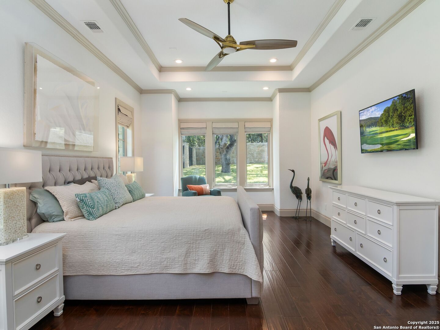 110 Manorbrook San Antonio, TX 78230 - Photo 24 of 40 a bedroom with a large bed and a flat tv screen on dresser