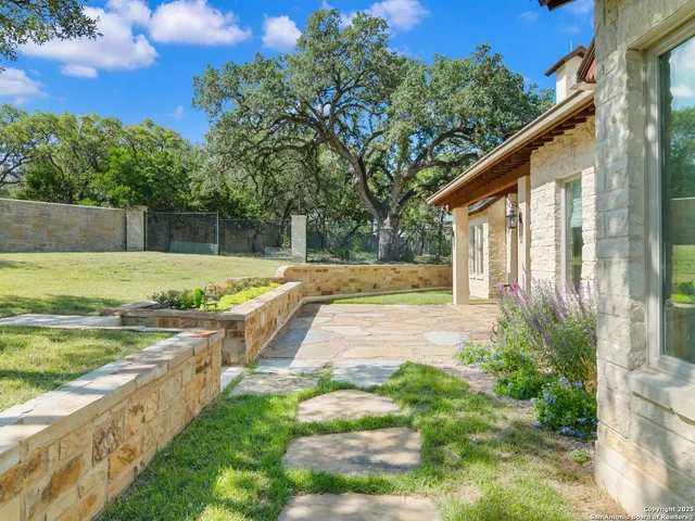 a view of a backyard with swimming pool