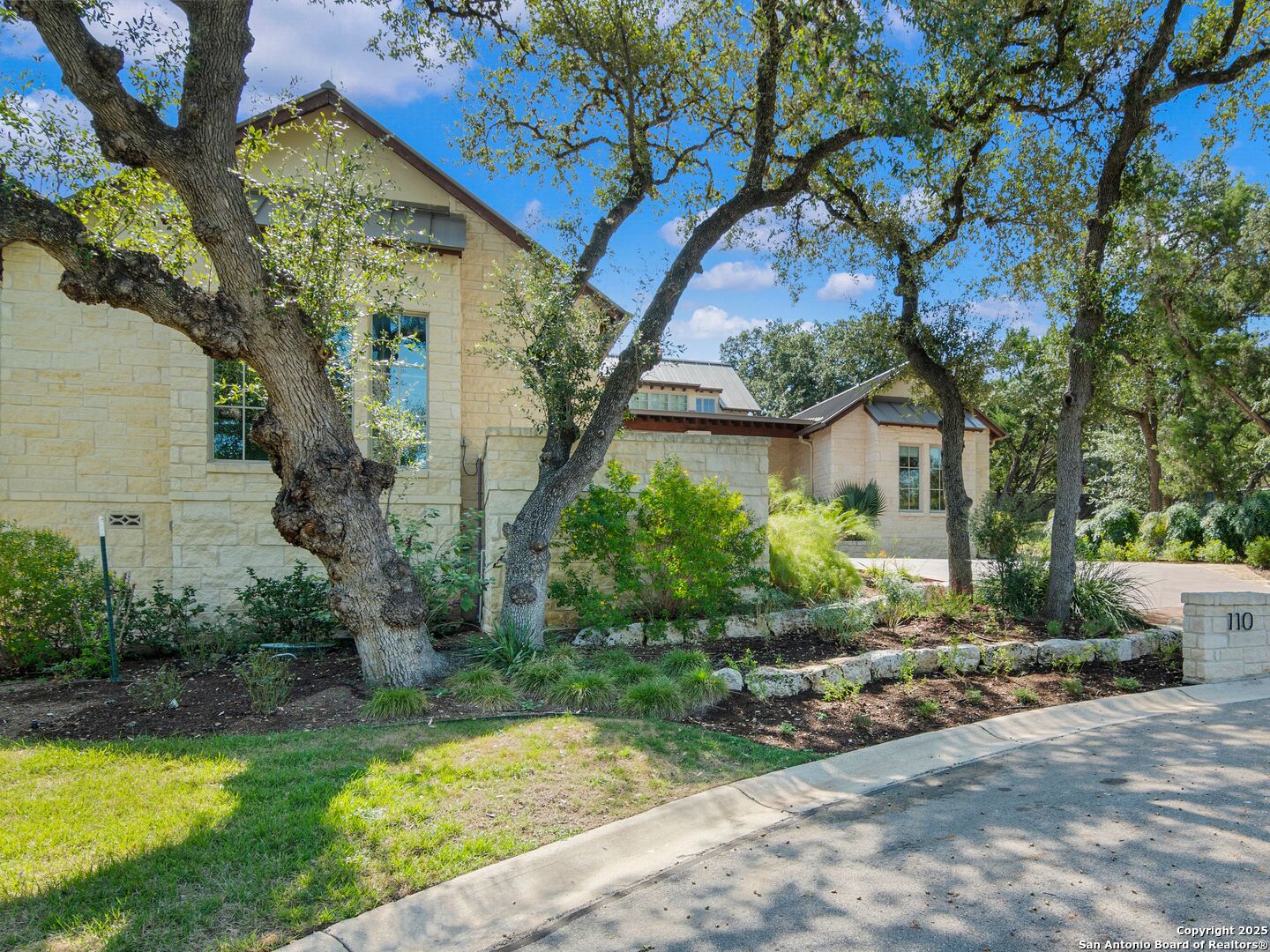 110 Manorbrook San Antonio, TX 78230 - Photo 37 of 40 a view of a house with a yard and potted plants