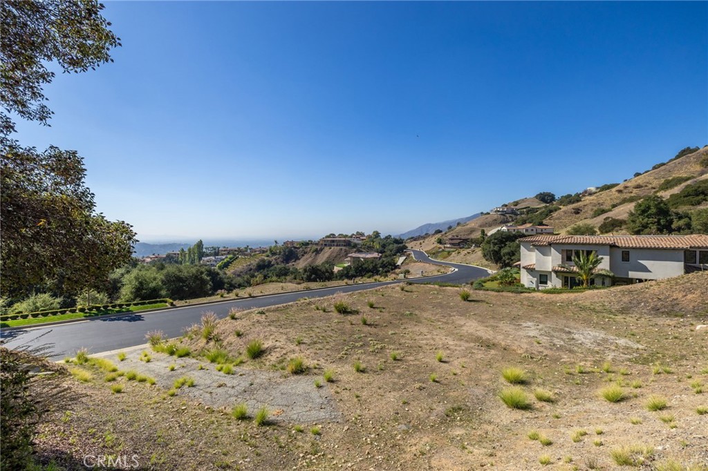 657 Gordon Highlands Road Glendora, CA 91741 - Photo 11 of 31 a view of a road with a yard