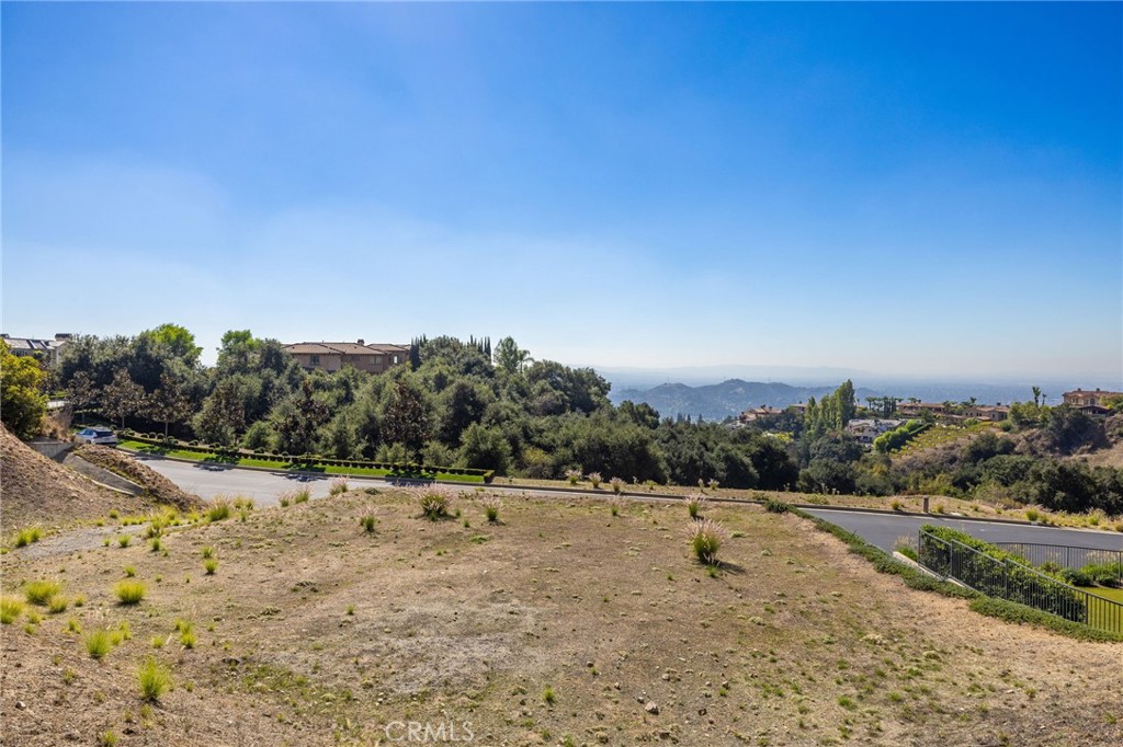 657 Gordon Highlands Road Glendora, CA 91741 - Photo 9 of 31 a view of a dry yard with trees
