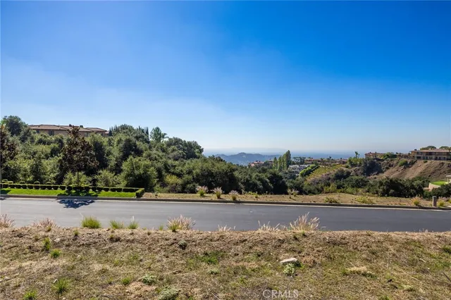 a view of a road with a yard