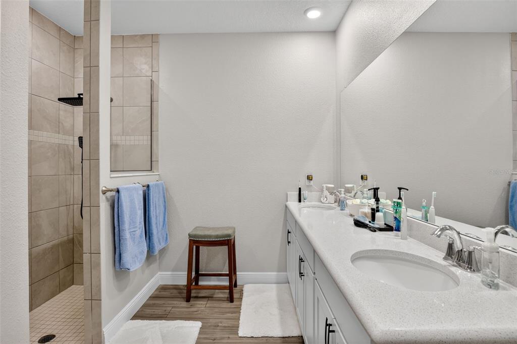 9839 Southwest 40th Terrace Ocala, FL 34476 - Photo 16 of 16 a bathroom with a sink and a mirror