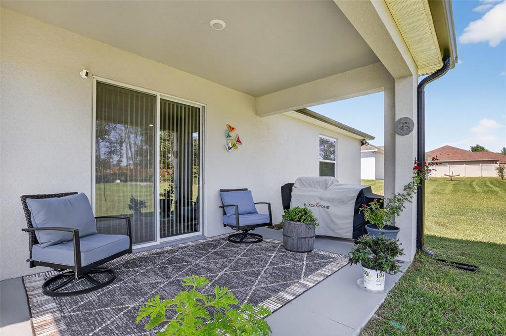 9839 Southwest 40th Terrace Ocala, FL 34476 - Photo 2 of 16 a view of a patio with furniture and a potted plant