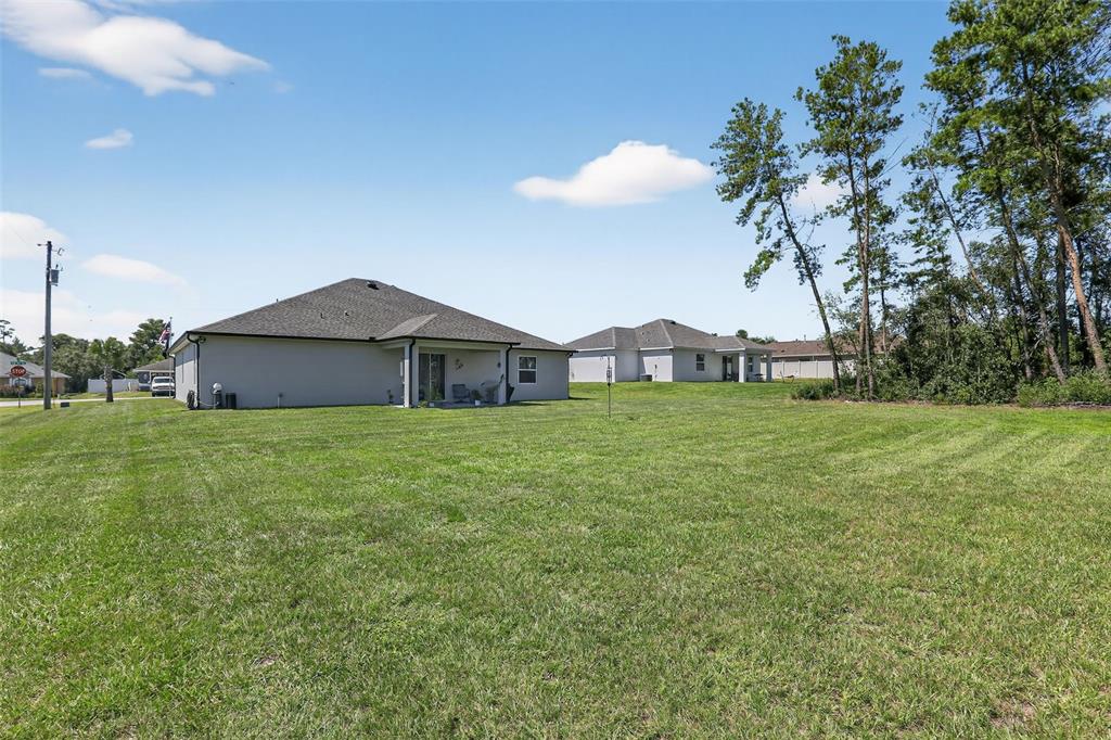 9839 Southwest 40th Terrace Ocala, FL 34476 - Photo 4 of 16 a front view of house with a garden