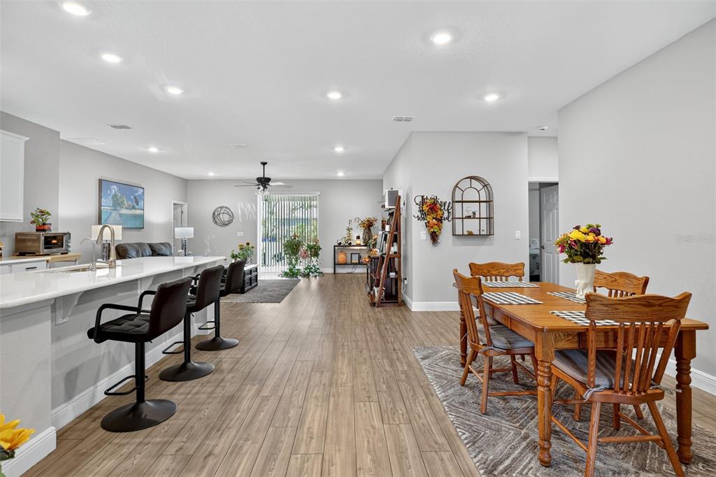 9839 Southwest 40th Terrace Ocala, FL 34476 - Photo 10 of 16 a living room with furniture and wooden floor