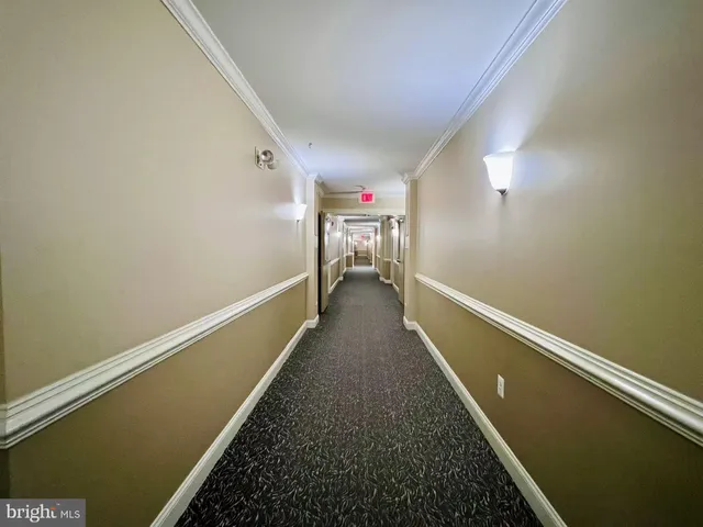 a view of a hallway with stairs