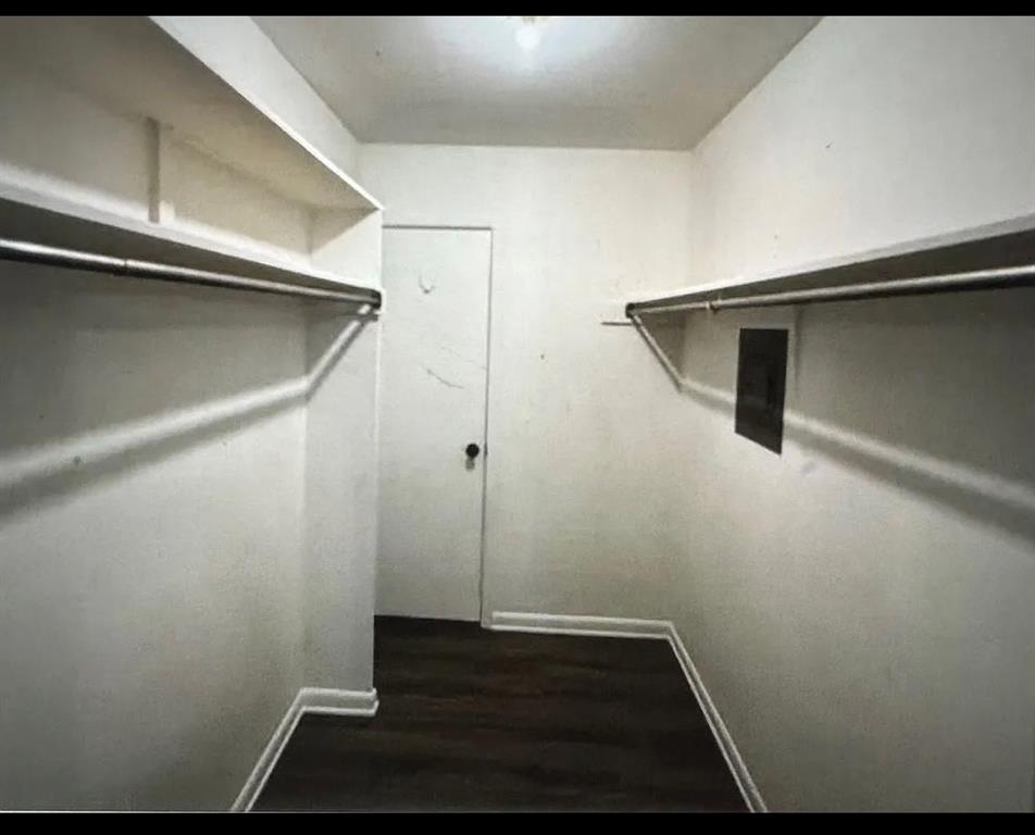 7000 Creswell Road, Unit 223 Shreveport, LA 71106 - Photo 14 of 16 Walk in closet with dark wood finished floors