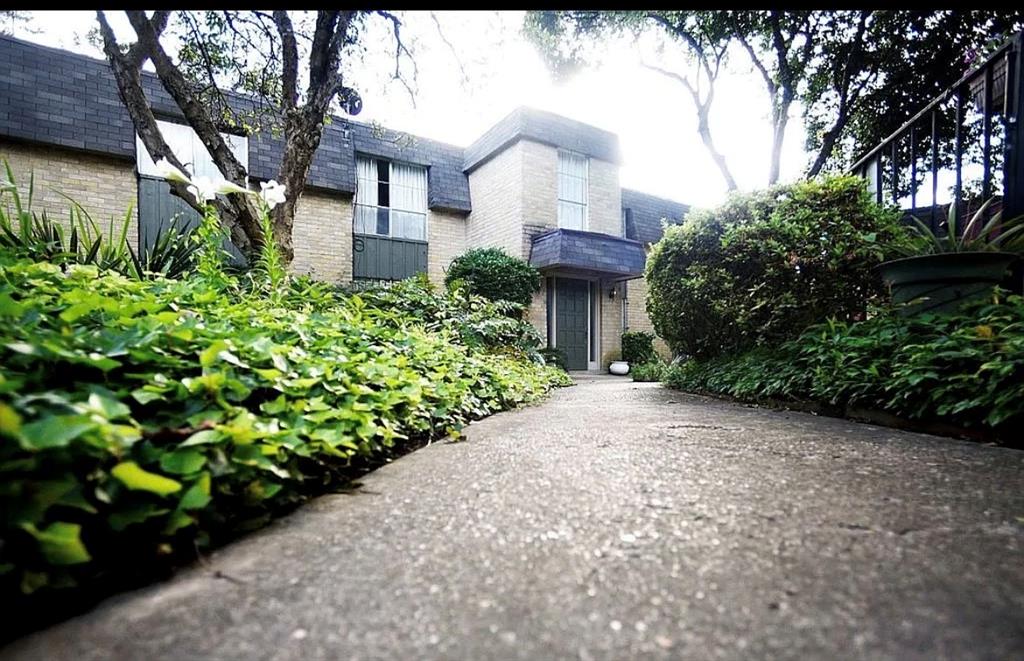 7000 Creswell Road, Unit 223 Shreveport, LA 71106 - Photo 2 of 16 View of front of building featuring brick siding and mansard roof