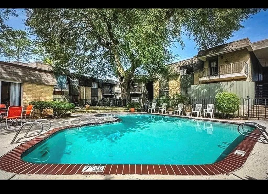 7000 Creswell Road, Unit 223 Shreveport, LA 71106 - Photo 3 of 16 Community pool with fence, a patio, and a residential view