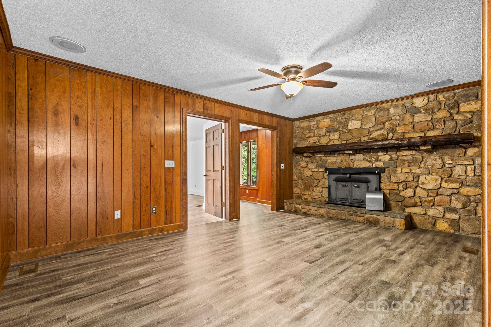 1653 Dudley Shoals Road Granite Falls, NC 28630 - Photo 17 of 48 a view of an empty room with a fireplace and a window