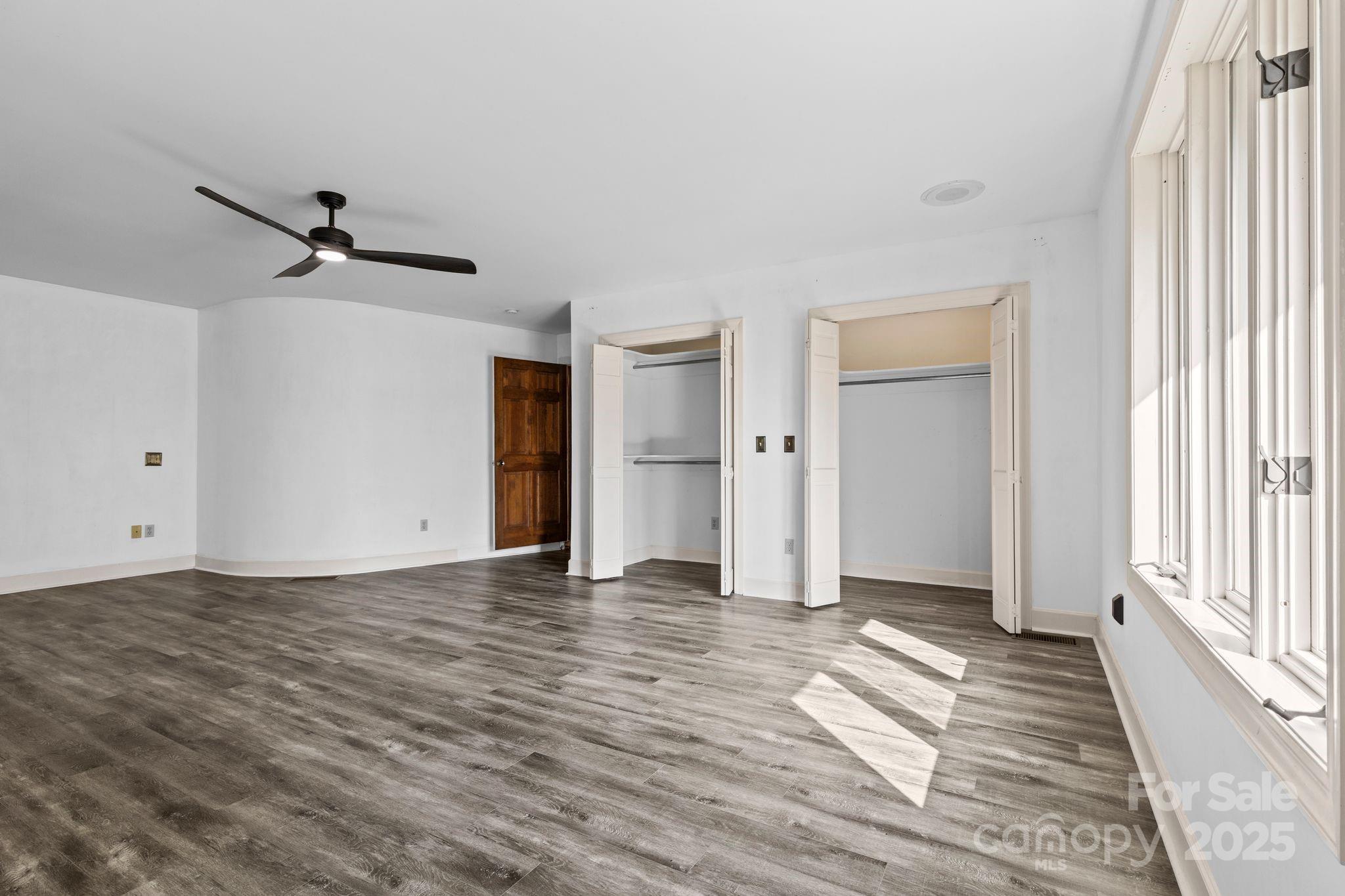 1653 Dudley Shoals Road Granite Falls, NC 28630 - Photo 22 of 48 a view of empty room with wooden floor and fan