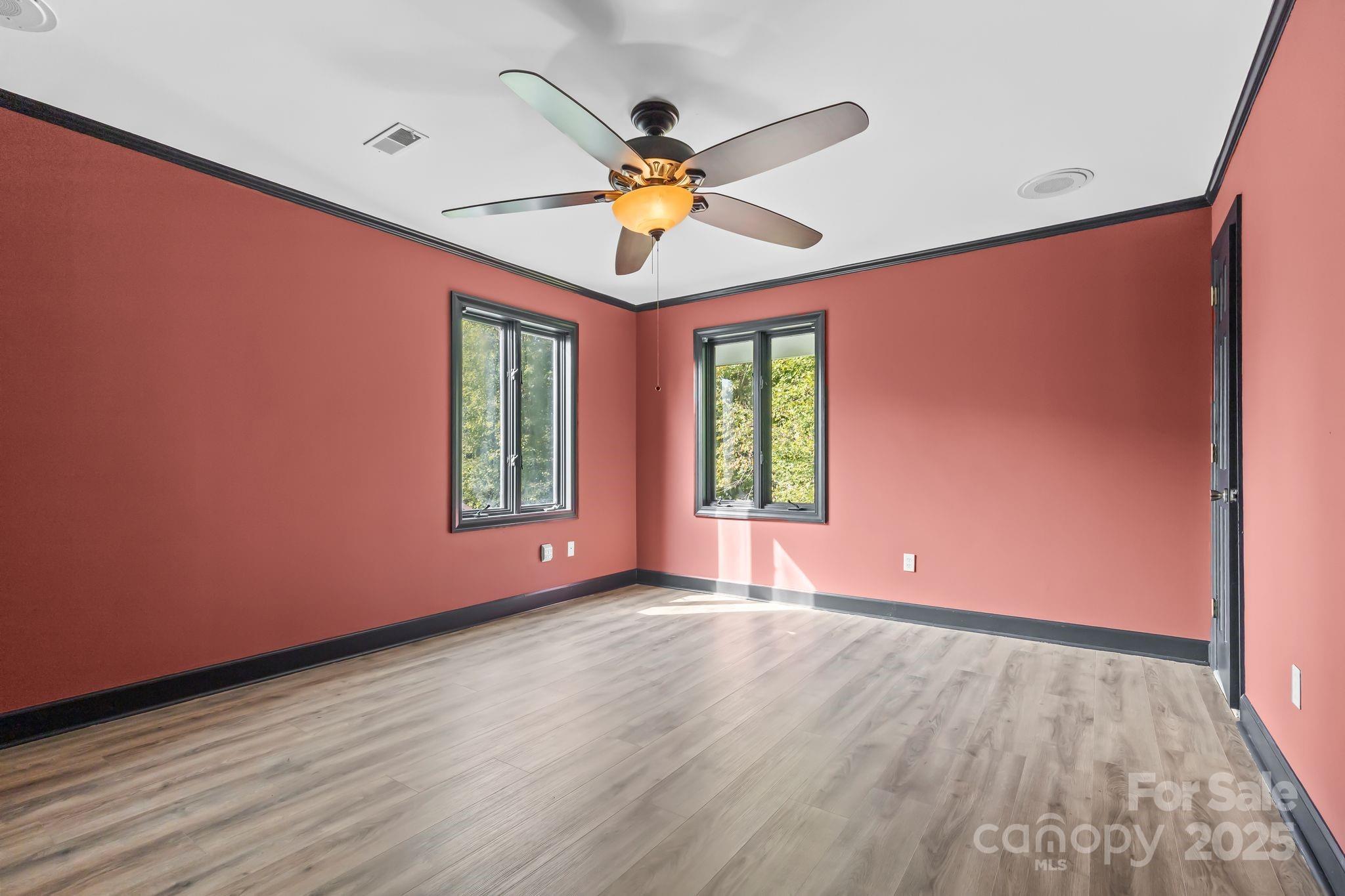 1653 Dudley Shoals Road Granite Falls, NC 28630 - Photo 26 of 48 a view of room with window ceiling fan and hardwood floor
