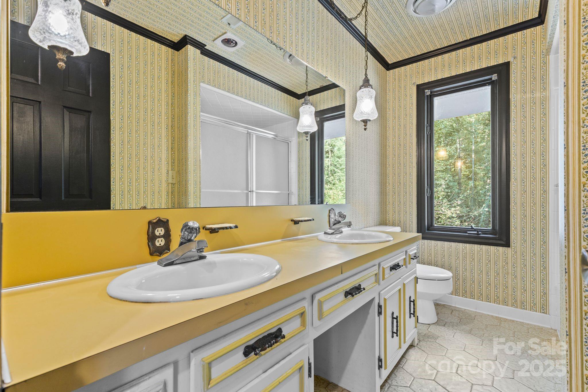 1653 Dudley Shoals Road Granite Falls, NC 28630 - Photo 29 of 48 a bathroom with a sink and a mirror