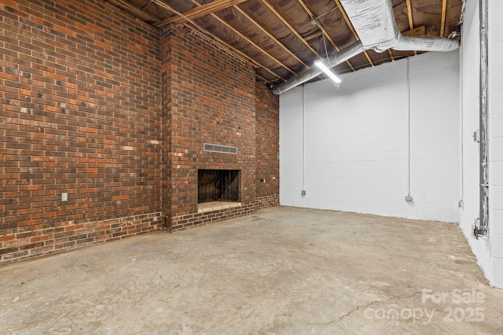 1653 Dudley Shoals Road Granite Falls, NC 28630 - Photo 32 of 48 a view of an empty room with a fireplace