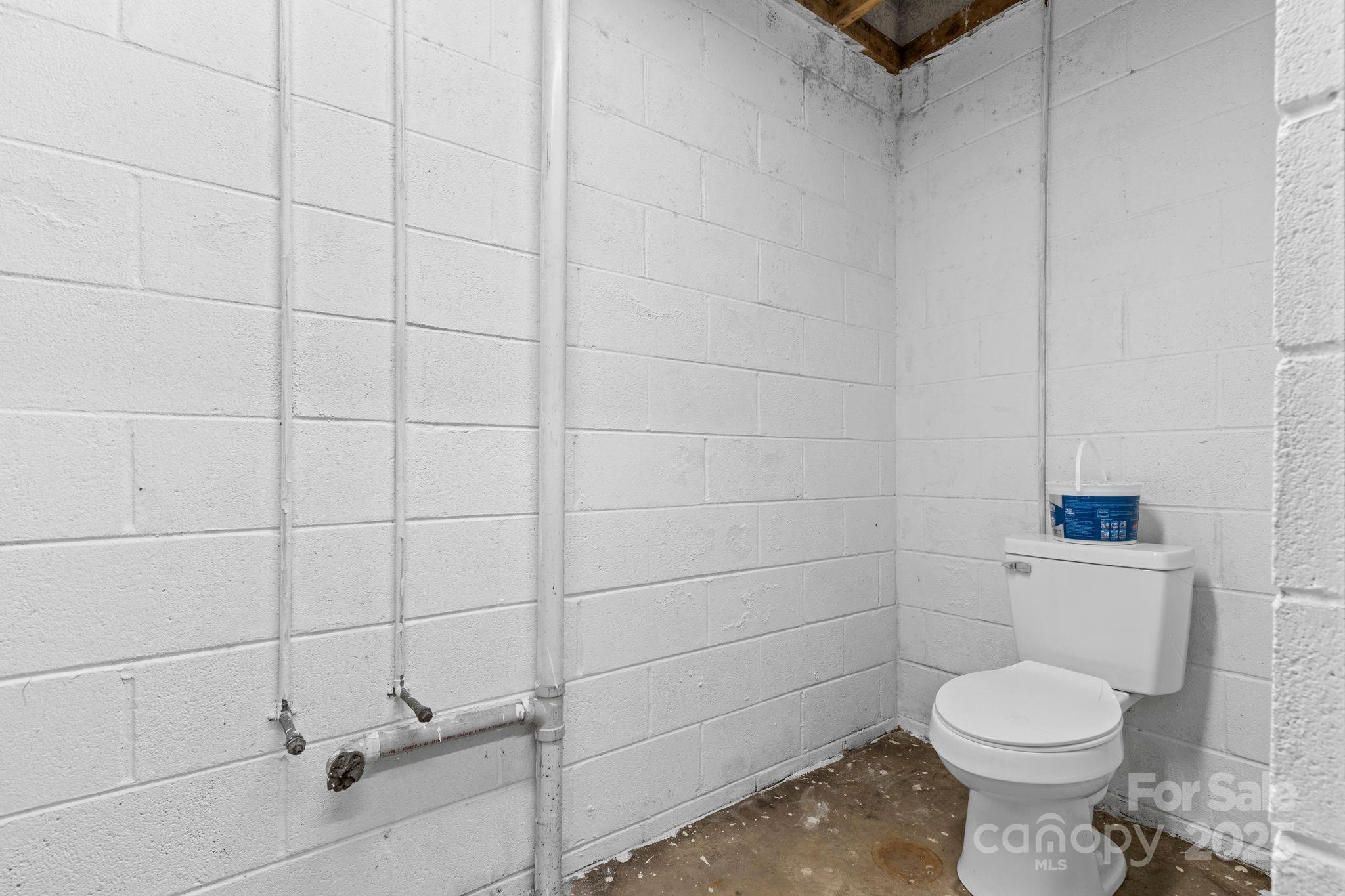 1653 Dudley Shoals Road Granite Falls, NC 28630 - Photo 33 of 48 a bathroom with a toilet and a sink