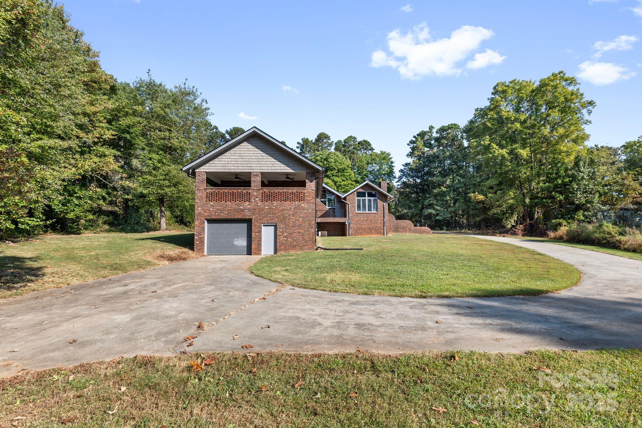 1653 Dudley Shoals Road Granite Falls, NC 28630 - Photo 38 of 48 a backyard of a house with lots of green space