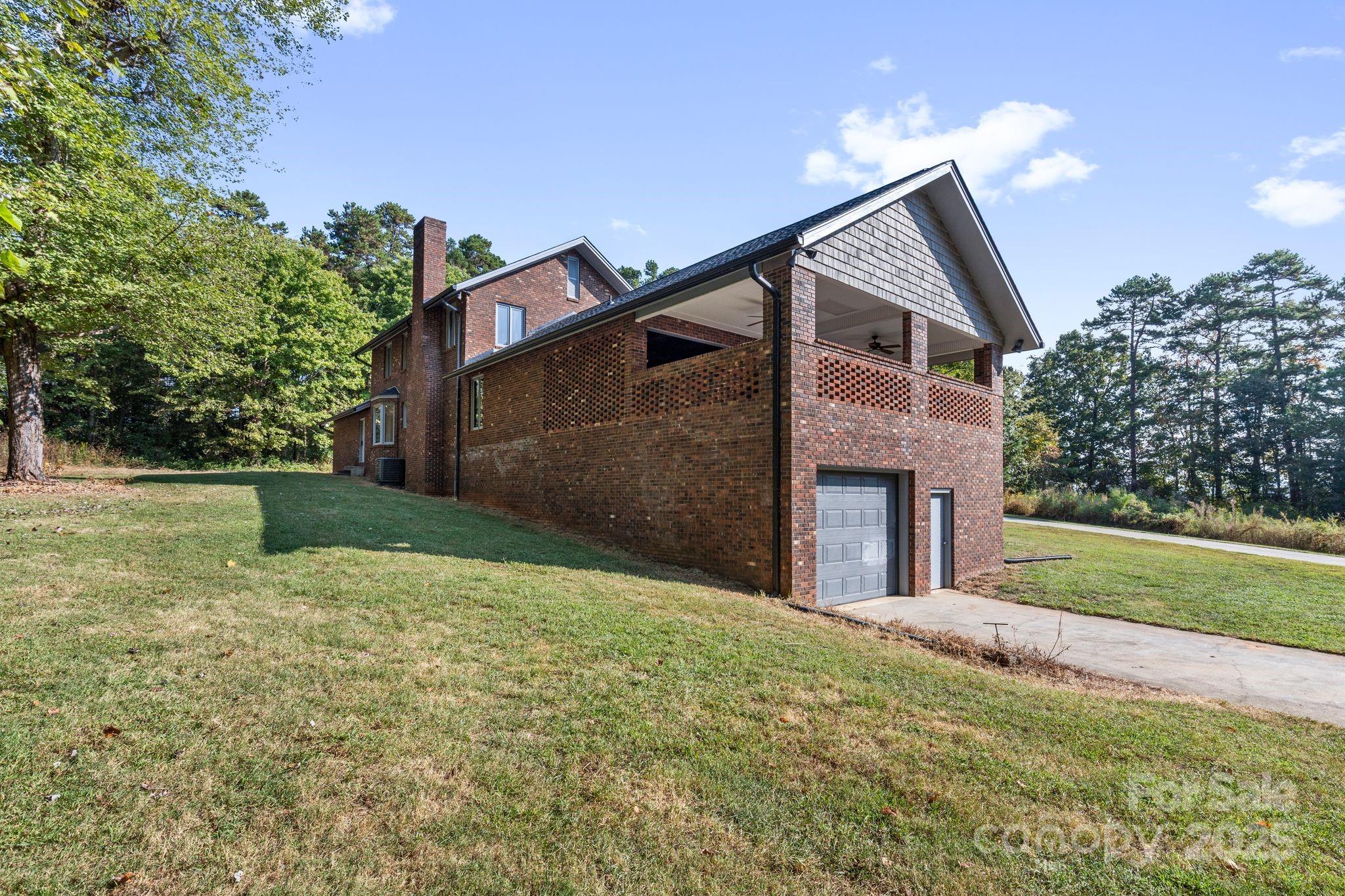 1653 Dudley Shoals Road Granite Falls, NC 28630 - Photo 39 of 48 a front view of a house with garden