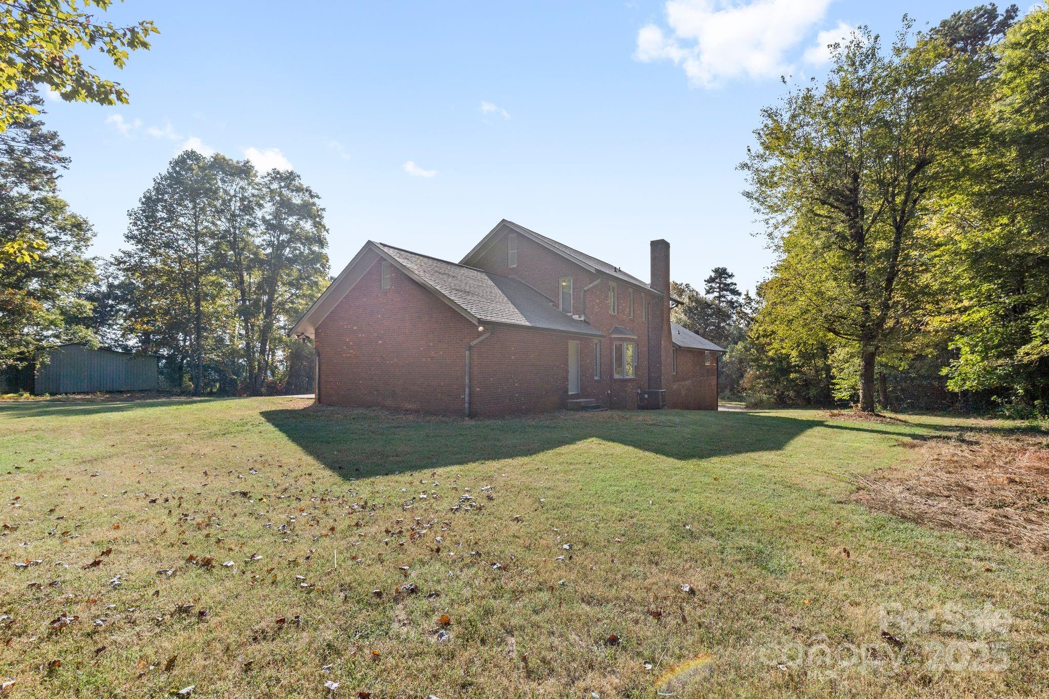 1653 Dudley Shoals Road Granite Falls, NC 28630 - Photo 40 of 48 a backyard of a house