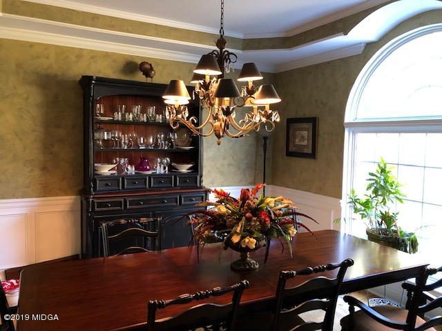 577 Old Popes Ferry Road Juliette, GA 31046 - Photo 12 of 49 a dining room filled with furniture and chandelier