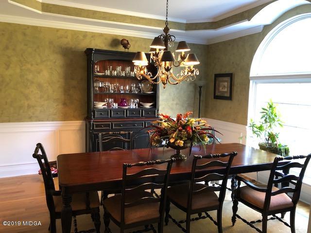 577 Old Popes Ferry Road Juliette, GA 31046 - Photo 13 of 49 a view of a dining room with furniture and chandelier