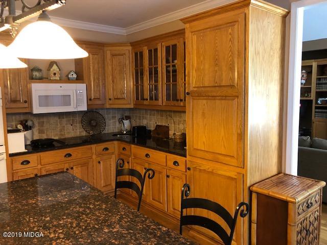 577 Old Popes Ferry Road Juliette, GA 31046 - Photo 18 of 49 a kitchen with stainless steel appliances granite countertop a refrigerator and a stove