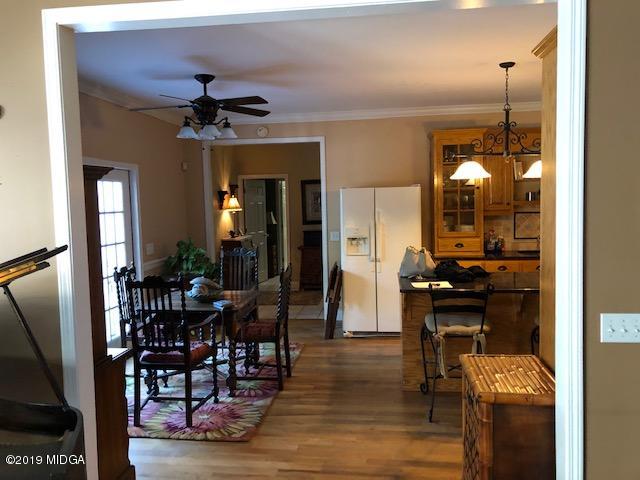 577 Old Popes Ferry Road Juliette, GA 31046 - Photo 19 of 49 a view of a dining room with furniture window and wooden floor