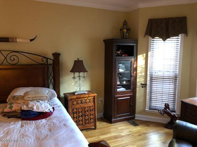 577 Old Popes Ferry Road Juliette, GA 31046 - Photo 20 of 49 a bedroom with a bed and a window