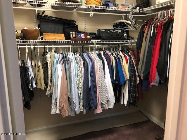 577 Old Popes Ferry Road Juliette, GA 31046 - Photo 27 of 49 a view of walk in closet with clothes and shoes
