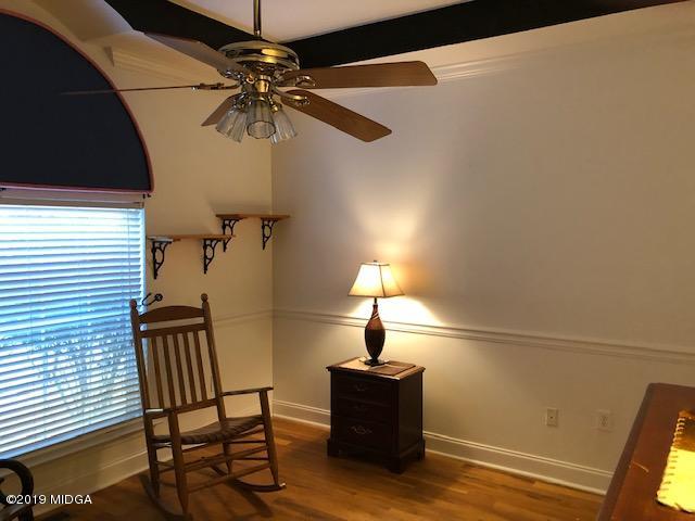 577 Old Popes Ferry Road Juliette, GA 31046 - Photo 28 of 49 a lamp on a table with a chair