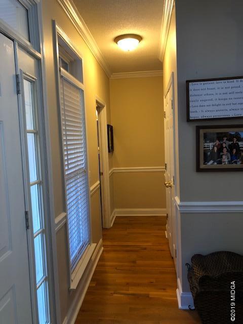 577 Old Popes Ferry Road Juliette, GA 31046 - Photo 30 of 49 a view of a hallway with wooden floor and staircase