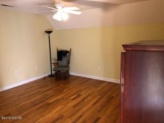 577 Old Popes Ferry Road Juliette, GA 31046 - Photo 32 of 49 a view of a room with wooden floor and windows