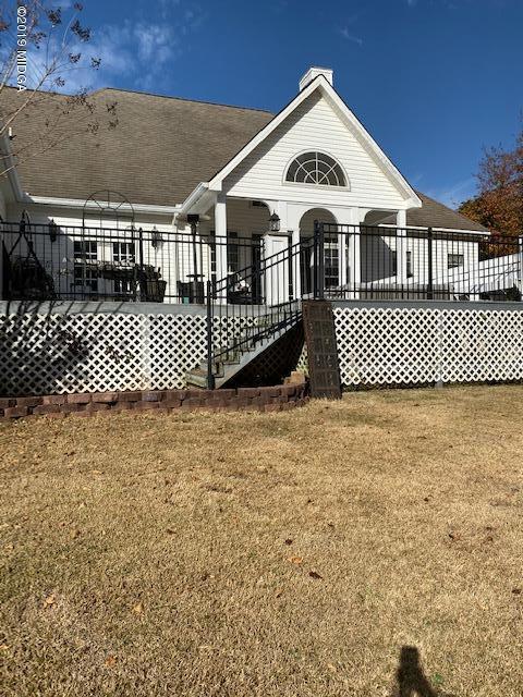 577 Old Popes Ferry Road Juliette, GA 31046 - Photo 37 of 49 a view of a brick house with wooden fence